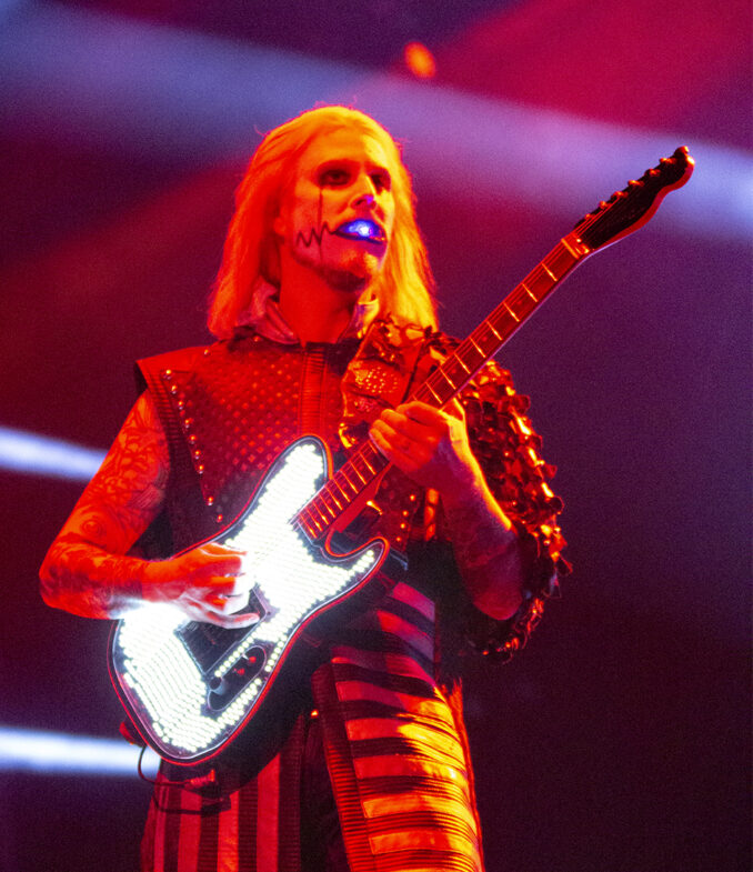 John 5 with a light show in his mouth on guitar.