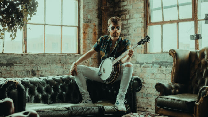 Fraser Edwards playing banjo.