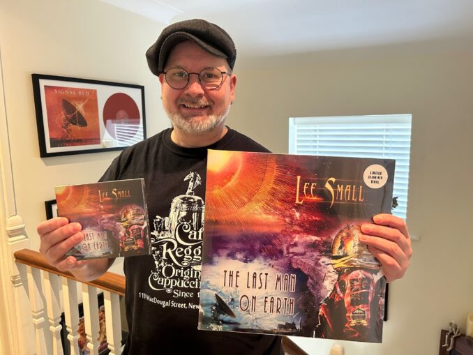 Lee Small holding copies of <em>The Last Man on Earth</em> Lee Small holding copies of The Last Man on Earth